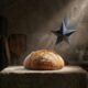 A sharp, falling 1-star review symbol hovering threateningly above a loaf of bread in a rustic kitchen.Featured Image Description: A cinematic 1:1 shot using minimal symbolic realism. A single, warm loaf of golden bread sits on a dark, rustic wooden surface. From the top of the frame, a sharp, jagged dark metal 1-star symbol falls toward the bread, suspended just above it in tension. The background is a soft-focus, dim kitchen with hints of flour in the air. Lighting is dramatic, focusing sharply on the texture of the bread and the threatening star.Featured Image Title: Shielding the Brand