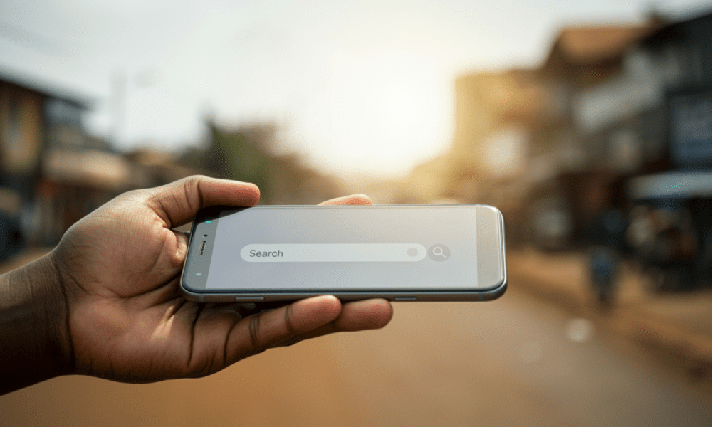 A close up of a hand holding a smartphone showing search intent data results.