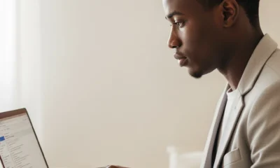 A focused Nigerian remote worker at a laptop, representing the rising number of individuals involved in taxing the modern digital nomad challenge.
