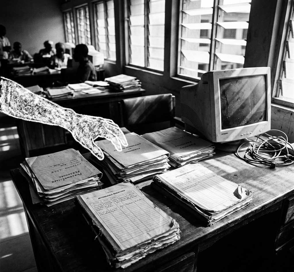 ghost workers Nigeria civil servant desk with personnel files and payroll documentsFeatured Image Description:
Interior photograph of a Nigerian government office showing a wooden desk stacked with old personnel files, handwritten attendance registers, and a dusty computer monitor. Natural light streams through louvered windows. The scene captures the administrative backlog where ghost workers thrive.Featured Image Title:
ghost-workers-nigeria-civil-servant-office-desk