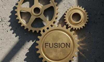 Three interlocking bronze gears symbolizing security agency coordination in Nigeria.