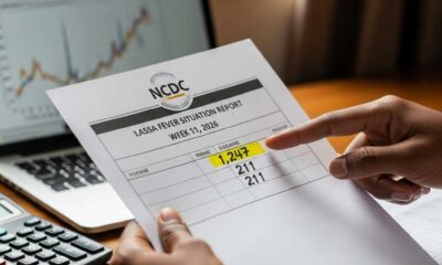 Close-up pointing on a printed health situation report.