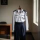 A crisp a police uniform hangs neatly, symbolizing professionalization reforms.