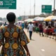 Woman walks Lagos street.