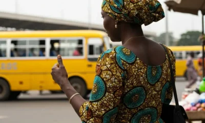 Woman at bus stop in Nigeria.