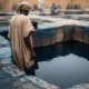 Dyer at indigo pit in Kano.