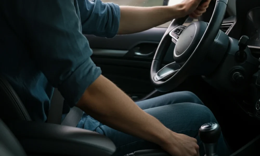 Driver at wheel preparing to renew license via FRSC portal