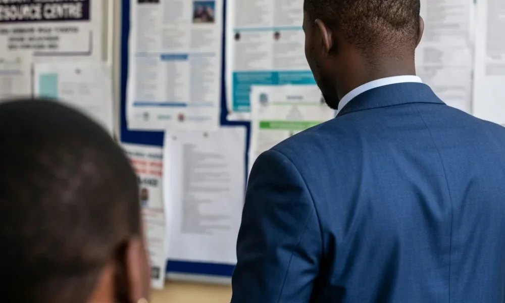 Man looks at overseas job postings.