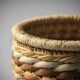 Woven basket with brown and beige patterns
