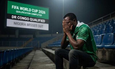 a despondent Nigerian football supporter in a green jersey, sitting alone in a darkened stadium with his head in his hands. In the background, a large digital scoreboard displays "FIFA WORLD CUP 2026 QUALIFICATION COMPLETED: DR CONGO QUALIFIED - NIGERIA MISSES OUT." A newspaper on the concrete floor carries the headline "SUPER EAGLES' DREAM DASHED.
