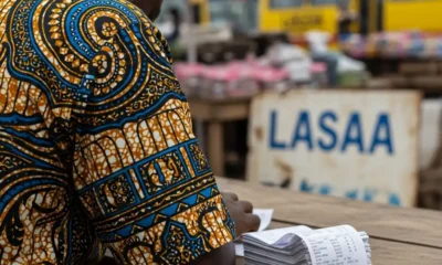 Trader with receipts at Lagos market.