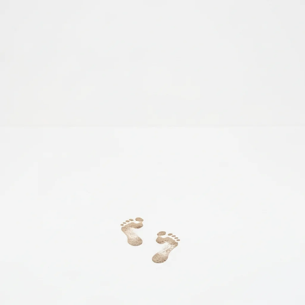 Barefoot footprints in reddish-brown earth