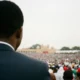Crowd watches performers in vibrant regalia at the Owo Igogo Festival in the Owo Palace grounds