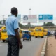 Man looks at traffic in Nigeria